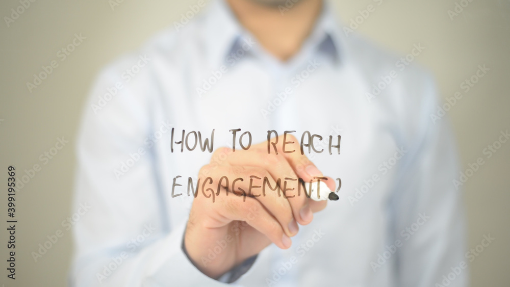 How To Reach Engagement , man writing on transparent screen How To Reach Engagement , man writing on transparent screen