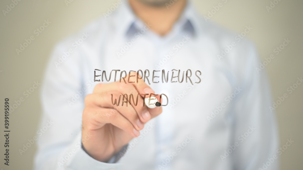 Entrepreneurs Wanted , man writing on transparent screen Entrepreneurs Wanted , man writing on transparent screen