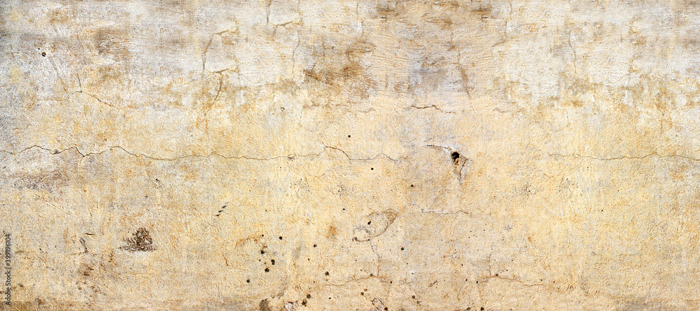 Old stucco wall texture of beige color