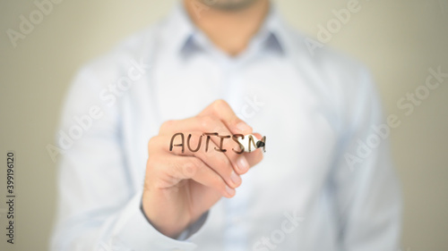Autism, man writing on transparent screen