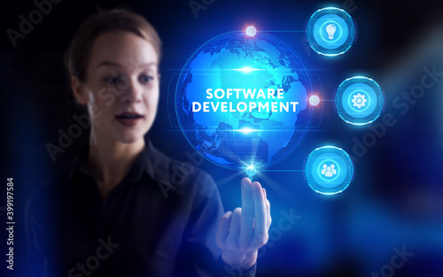 Business, Technology, Internet and network concept. Young businessman working on a virtual screen of the future and sees the inscription: Software development