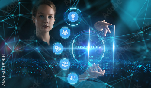 Business, Technology, Internet and network concept. Young businessman working on a virtual screen of the future and sees the inscription: Remarketing