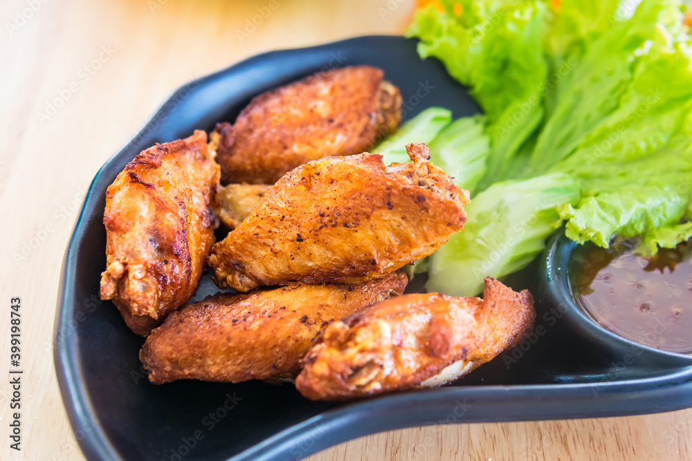 Traditional Thai fired chicken wing close up. Traditional Thai fired chicken wing close up.