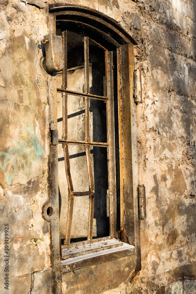 old empty barred window in the house