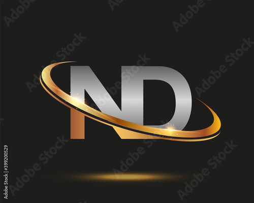 initial letter ND logotype company name colored gold and silver swoosh design. isolated on black background.