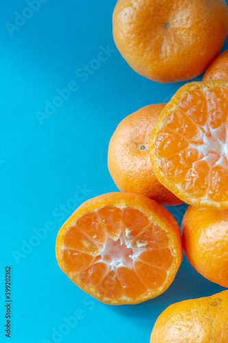 small mandarin oranges with blue backgrounds