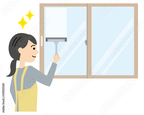 窓をワイパー・スクイジーで掃除するエプロンの女性　Woman cleaning the window