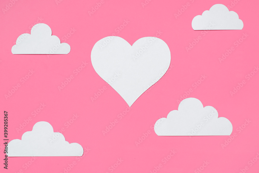 Heart and clouds cut from paper. Flatlay, pink festive background. Valentine's Day concept, love poster, greeting card. Heart and clouds cut from paper. Flatlay, pink festive background. Valentine's Day concept, love poster, greeting card.