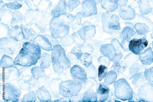 Sea salt crystals on a white background. Tinted blue.