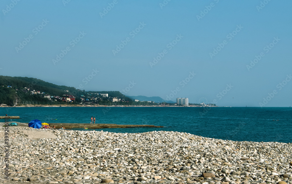 pebble beach on the black sea with a view of the city of Sochi