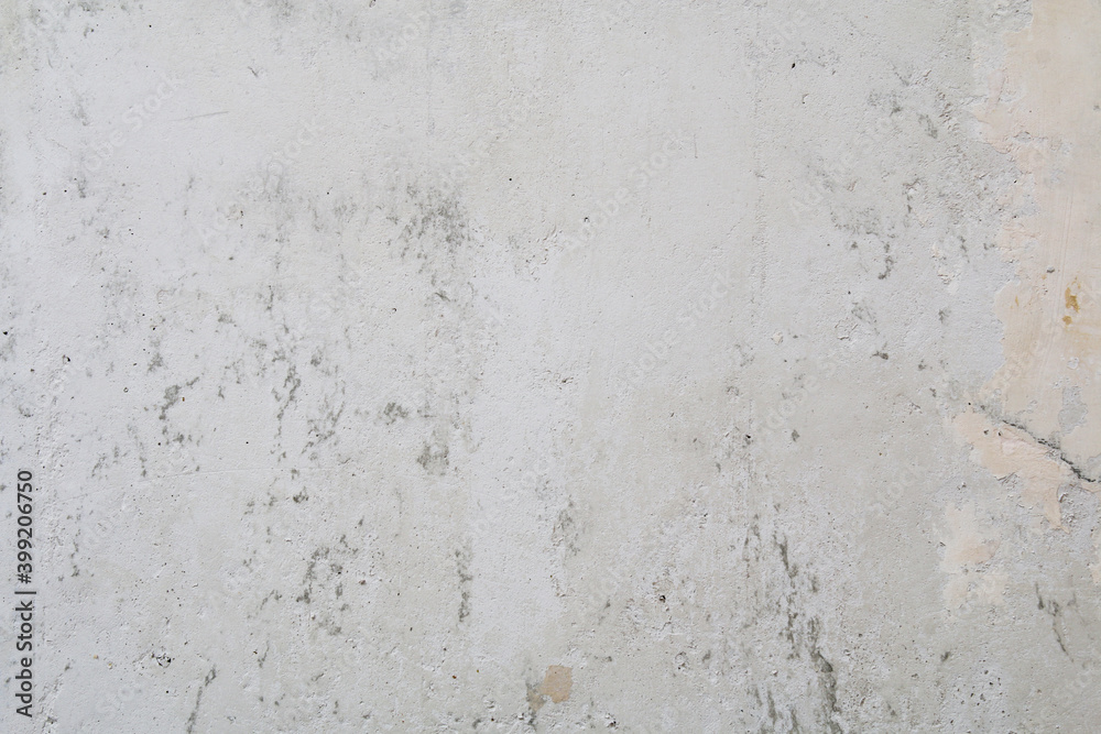 Fototapeta premium Gray concrete wall peeled of wallpaper. Concrete background.