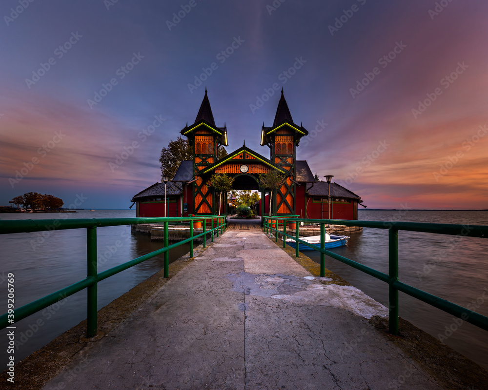 Keszthely, Hungary - The beautiful Pier of Keszthely by the Lake Balaton with a colorful autumn sunset. Famous touristic attraction in Zala county