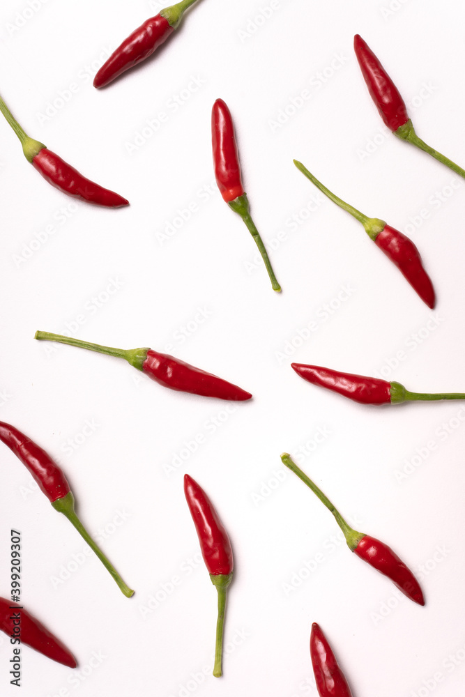 scattered group of hot peppers on white. graphic effect. chillies typical of the Calabria region, Italy scattered group of hot peppers on white. graphic effect. chillies typical of the Calabria region, Italy