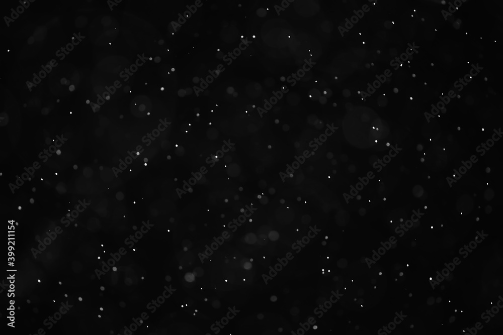 Fototapeta premium snow black background abstract texture, snowflakes falling in the sky overlay