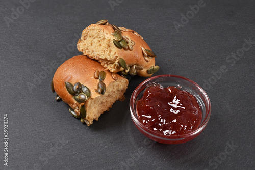 Pastry homemade with jam in glass bowl on wooden background breakfast