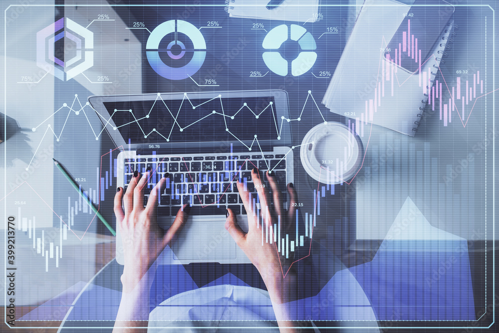 Double exposure of woman hands working on computer and forex chart hologram drawing. Top View. Financial analysis concept.