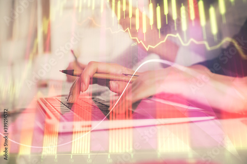 Multi exposure of woman hands typing on computer and financial graph hologram drawing. Stock market analysis concept.