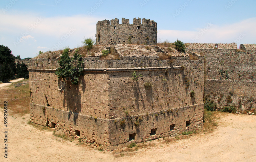 Rhodes fortifications, fortress wall with a carved coat of arms, medieval fortress, the old town of Rhodes, Greece