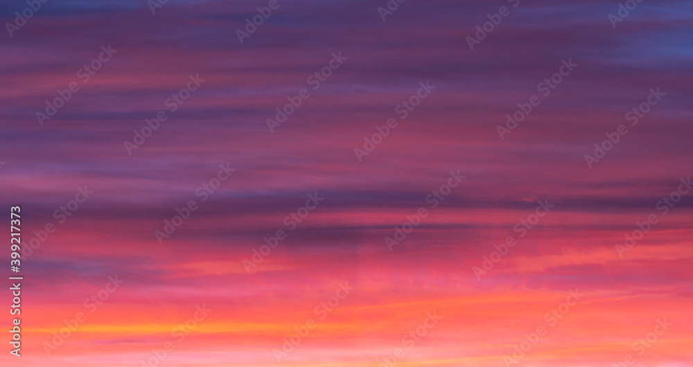 Backgrounds and textures. Beautiful and dramatic colorful sky with clouds at sunset. Sky texture. Abstract nature background.