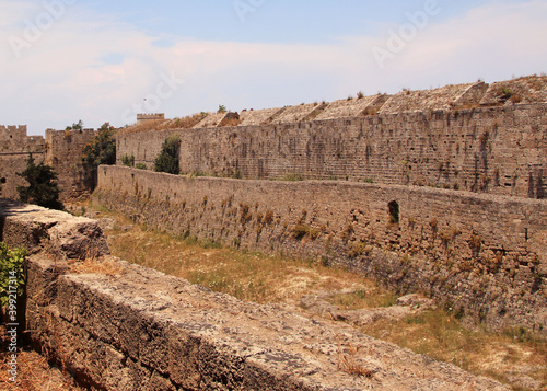 Rhodes fortifications, fortress wall with a carved coat of arms, medieval fortress, the old town of Rhodes, Greece