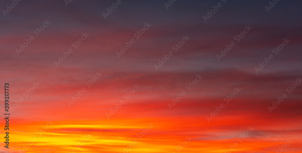 Backgrounds and textures. Beautiful and dramatic colorful sky with clouds at sunset. Sky texture. Abstract nature background.