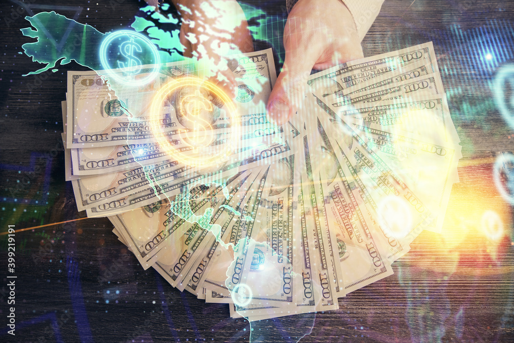 Multi exposure of financial graph drawing hologram and USA dollars bills and man hands. Analysis concept. Multi exposure of financial graph drawing hologram and USA dollars bills and man hands. Analysis concept.