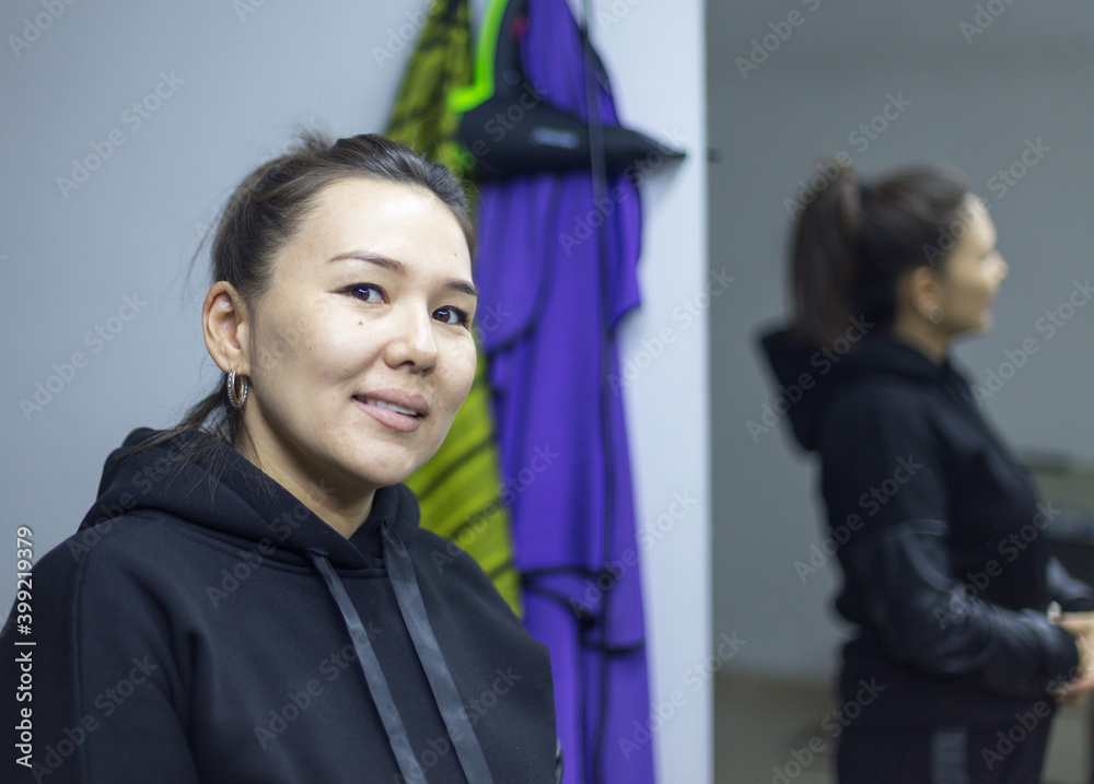 beautiful girl posing in front of a mirror on a dark background beautiful girl posing in front of a mirror on a dark background