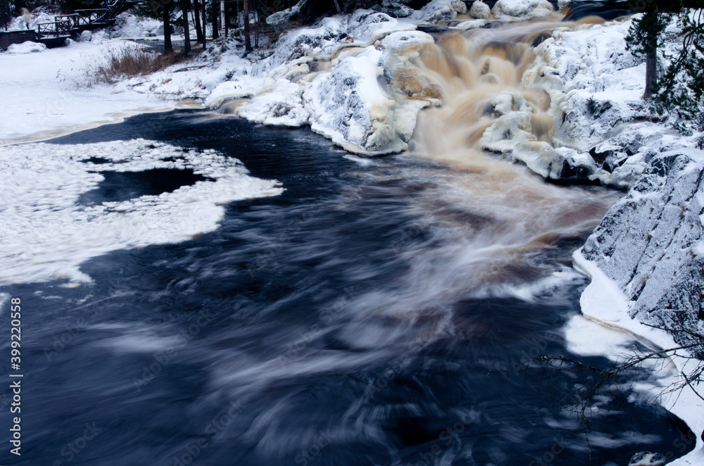 Waterfall. Winter forest. Karelia