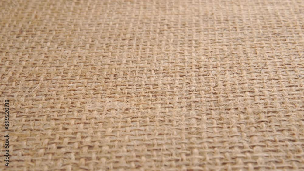 Burlap texture macro shot. Sackcloth fibers in rows. Close up. Dolly Shot Burlap texture macro shot. Sackcloth fibers in rows. Close up. Dolly Shot