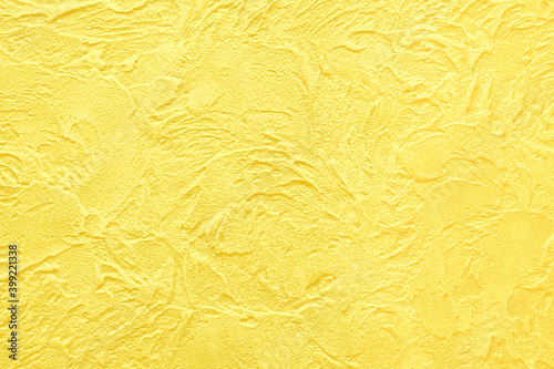 Luxury Illuminating Yellow background. Venetian textured plaster walls with glaze finish. The trending color of 2021.