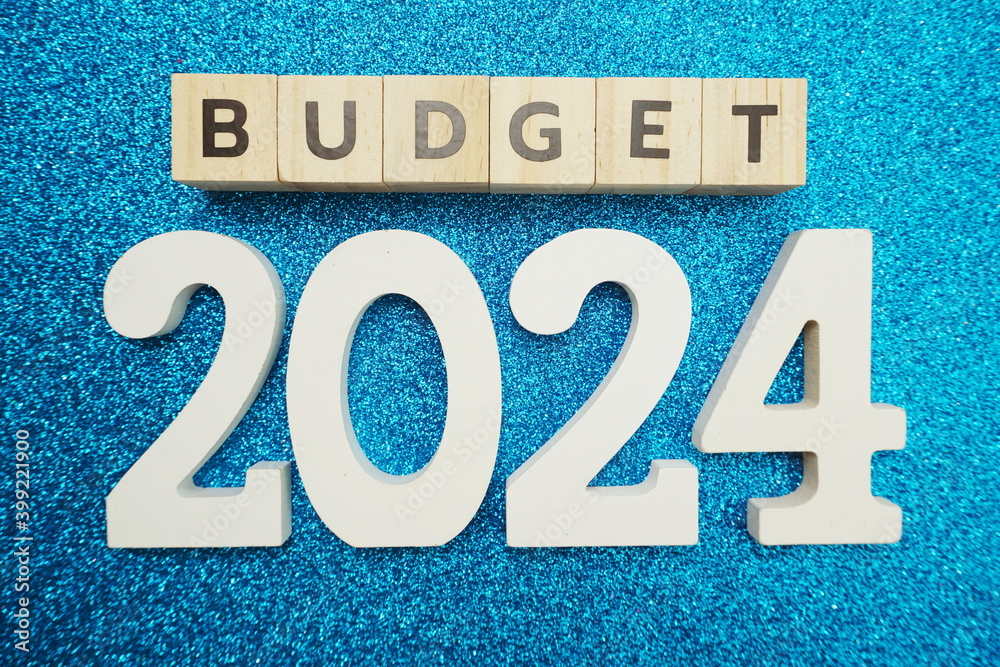 Budget 2024 alphabet letters on blue glitter background Stock Photo