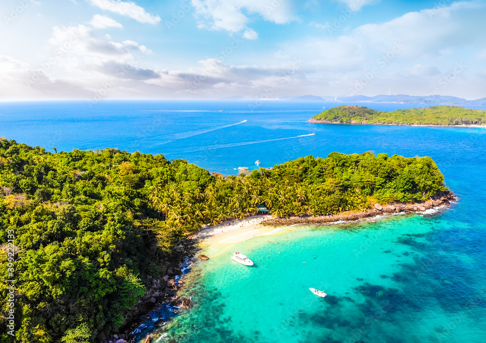 Aerial view of beautiful landscape, tourism boats, and people swimming on the sea and beach on May Rut island (a tranquil island with beautiful beach) in Phu Quoc, Kien Giang, Vietnam. Aerial view of beautiful landscape, tourism boats, and people swimming on the sea and beach on May Rut island (a tranquil island with beautiful beach) in Phu Quoc, Kien Giang, Vietnam.
