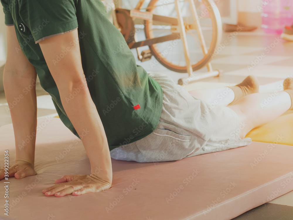 Naklejka premium Stretching after yoga exercise.