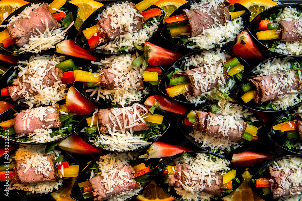 Fototapeta premium Beautifully decorated catering banquet table with different food snacks and appetizers with sandwich