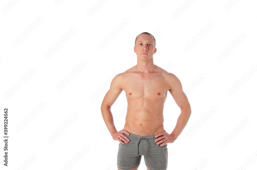 Fototapeta premium Fashion portrait of strong brutal guy with a modern trendy hairstyle. Sexy torso. Male flexing his muscles. Sport workout bodybuilding.