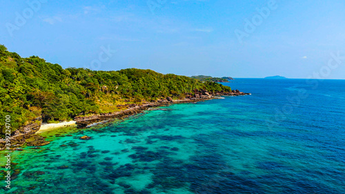 Aerial view of beautiful landscape, tourism boats, and people swimming on the sea and beach on May Rut island (a tranquil island with beautiful beach) in Phu Quoc, Kien Giang, Vietnam.