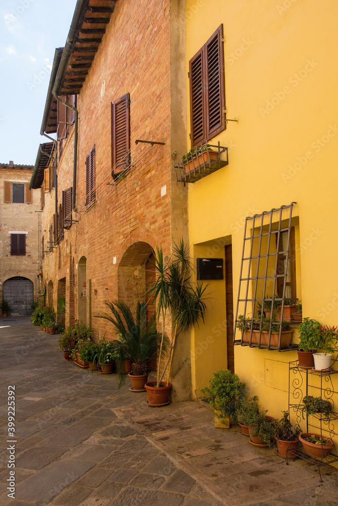 A quiet residential back street in the historic medieval village of Buonconvento, Siena Province, Tuscany, Italy
