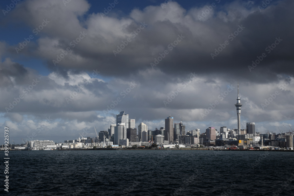 Auckland city skyline with clouds and blue sky