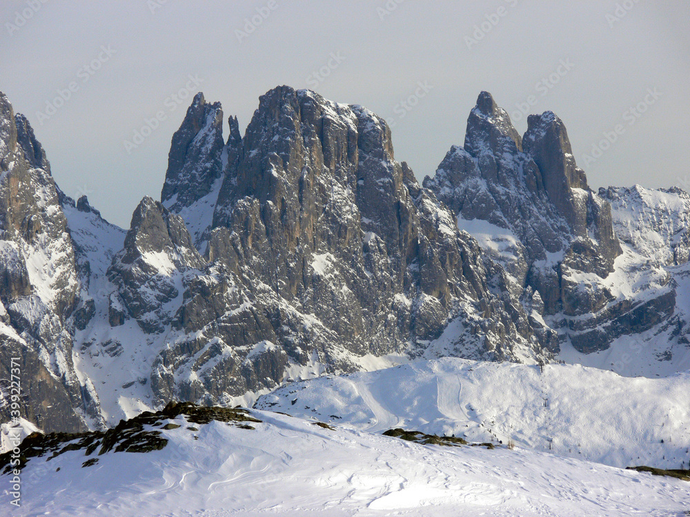 Rocky peaks of the snow covered Dolomite mountains in the Italian Alps