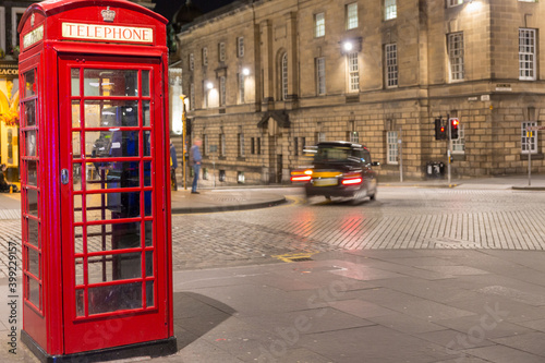 Classic red British telephone box, night scene