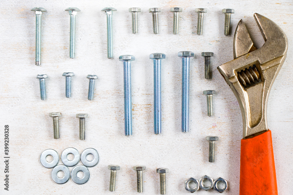 Fototapeta premium Monkey wrench and bolts on the white background