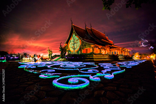 blurred abstract background of the twilight sky in the evening at one of the beautiful tourist spots in Ubon Ratchathani(Wat Sirindhorn Wararam)WatPhuPhrao,tourists always come see the glowing church. © bangprik