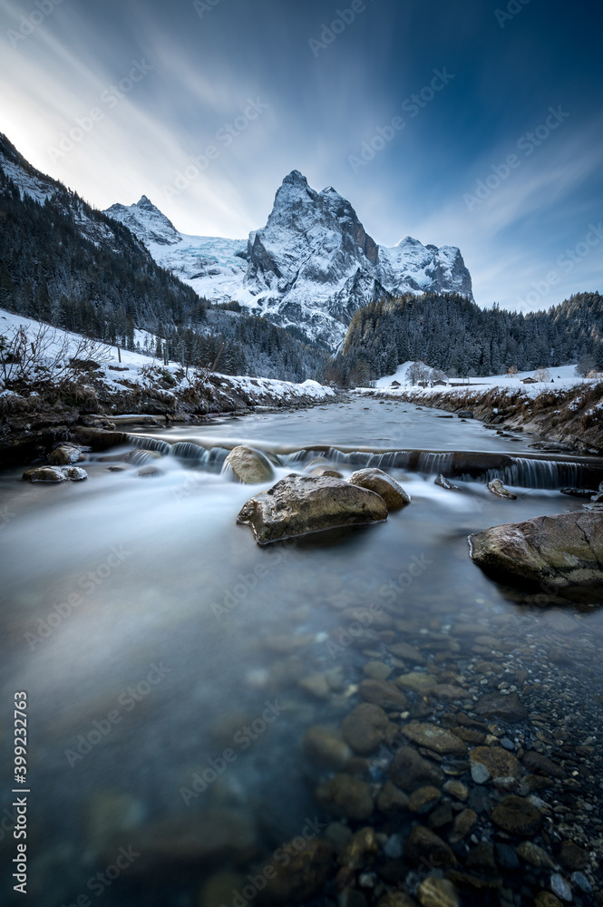 winter in Rosenlaui with Wellhorn and mountain creek Rychenbach, Switzerland