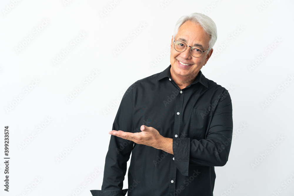 Middle age Brazilian man isolated on white background presenting an idea while looking smiling towards Middle age Brazilian man isolated on white background presenting an idea while looking smiling towards