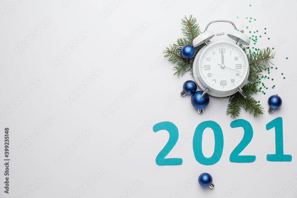 Fototapeta premium New Year composition with alarm clock and figure 2021 on light background