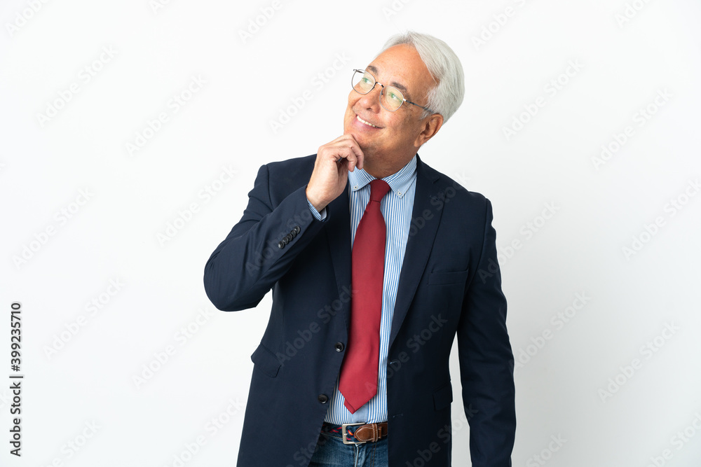 Middle age Brazilian business man isolated on white background looking up while smiling Middle age Brazilian business man isolated on white background looking up while smiling
