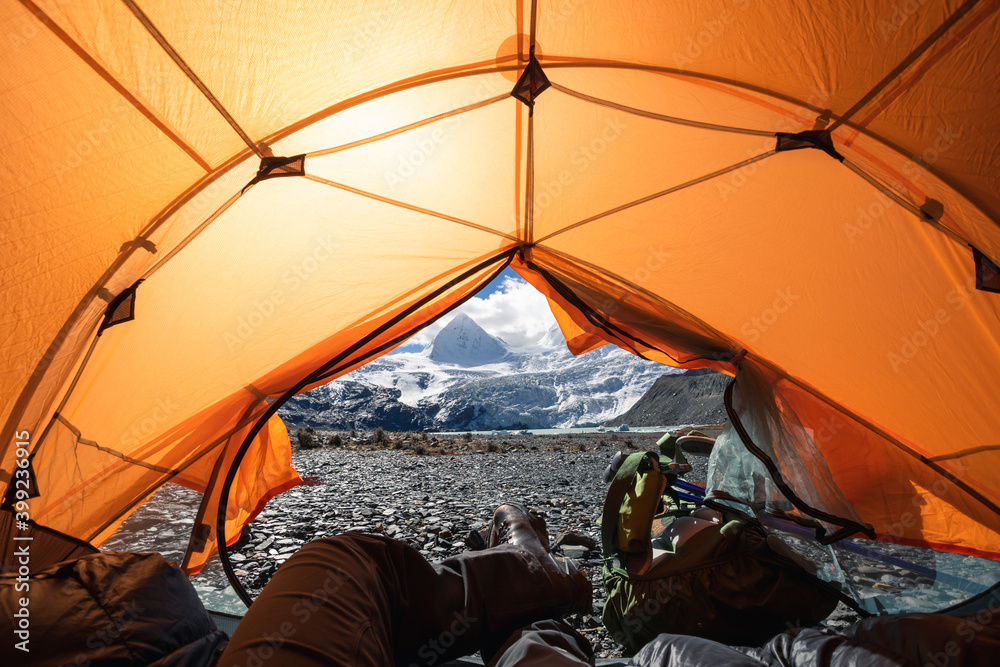 Hiker enjoy the beautiful landscape in tent - obrazy, fototapety, plakaty 