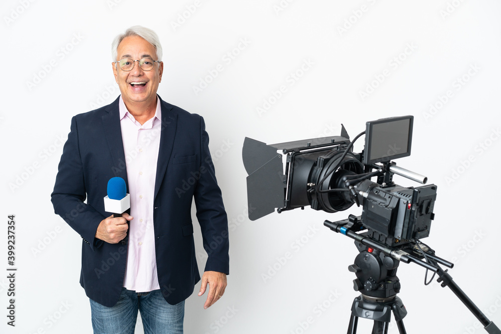 Reporter Middle age Brazilian man holding a microphone and reporting news isolated on white background with surprise facial expression