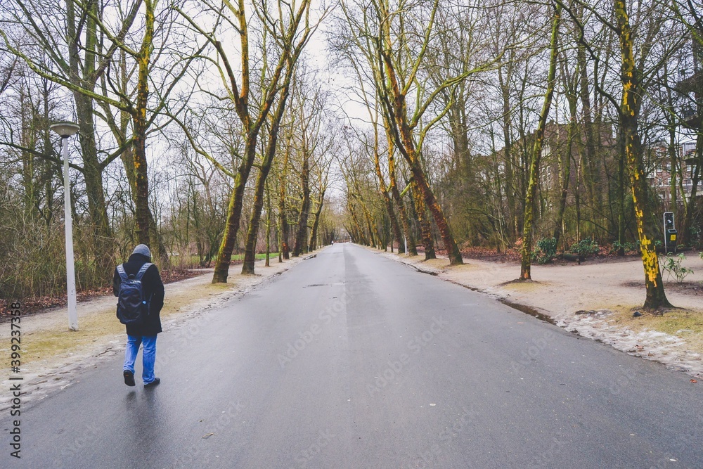 14.02.2012. Amsterdam. Netherland. A alone man waking in the roan of Vondelpark in Amsterdam. 