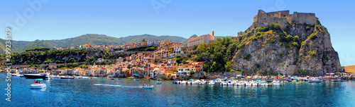 The southern coast of Scilla, Calabria, Italy, in midsummer, overlooking the bathing establishments and the old Ruffo Castle photo